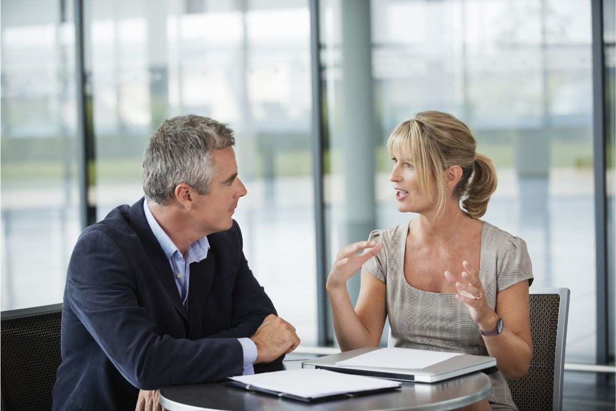first-time homebuyer talking with loan officer about mortgage options
